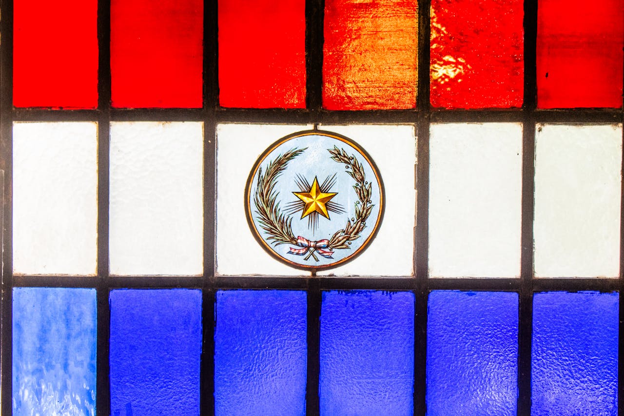 Stained glass in red, white, and blue featuring Paraguay